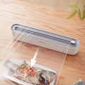 Food Wrap Dispenser Cutter With Suction Bottoms, Cling Film Wrapping Paper Cutter, Packaging Dispenser With Cutter, Storage Preservative Film Roll Case With Cutting Blade, New Cling Film Cutter